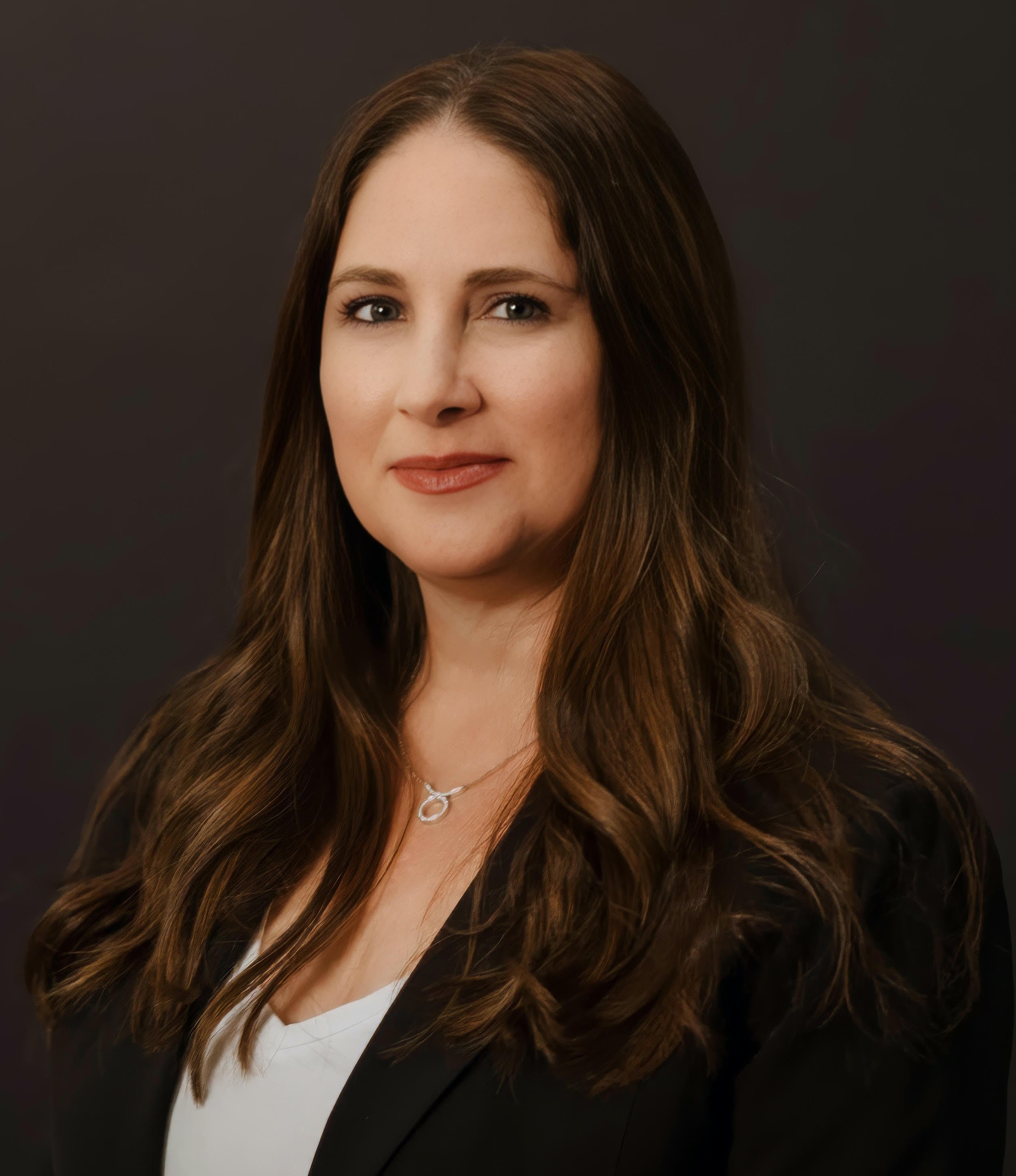 READYBAR advisor Jen Rochlis with long brown hair wearing a black blazer against a dark background