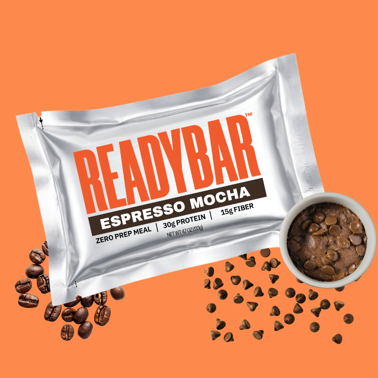 READYBAR Espresso Mocha meal bar packaging on an orange background with espresso beans and chocolate chips.